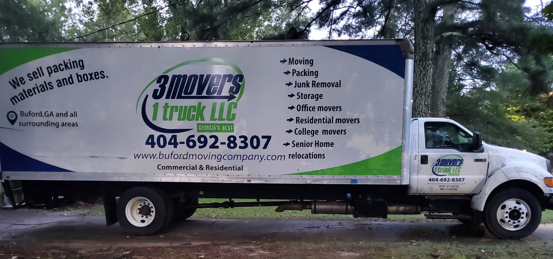 3 Movers 1 Truck Branded Moving Truck 3 Movers 1 Truck branded white moving truck parked outdoors, showcasing services like moving, packing, and junk removal.